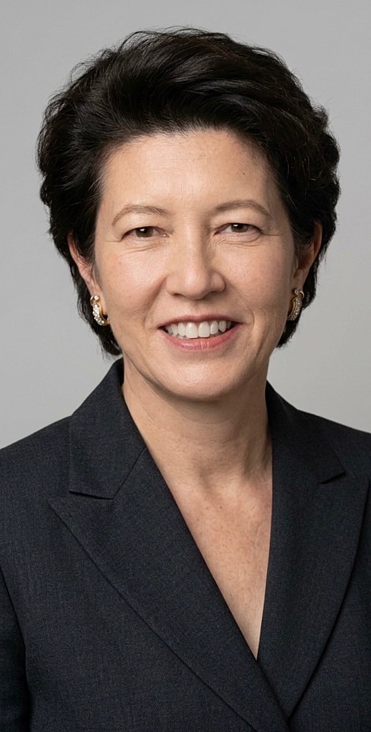 Professional headshot of a woman in a blazer.